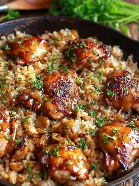 🍗 Rustic Cast-Iron Hibachi Chicken with Savory Garlic Butter Sauce There are some dinners that make you feel like you've ordered takeout without actually ordering takeout. This Rustic Cast-Iron Hibachi Chicken with Savory Garlic Butter Sauce is one of those meals. I love making it on evenings when everyone is hungry and I want something that feels exciting but doesn't require a complicated recipe. The chicken gets cut into juicy bite-sized pieces, seared in a screaming-hot cast-iron skillet, and then tossed with garlic, butter, soy sauce, sesame oil, and a little lemon. The result is ridiculously flavorful. You get those beautifully browned edges that make hibachi chicken so good, followed by buttery garlic, salty soy sauce, and just enough brightness from lemon to keep everything balanced. And the best part? You don't need a restaurant-style flat-top griddle. A heavy cast-iron skillet works beautifully for this kind of high-heat cooking. Recent hibachi-style recipes specifically recommend cast iron because it holds heat well and provides the hot, flat cooking surface needed for a good sear. I usually serve this with fried rice and vegetables, but honestly, the chicken is so good that you could put it over cauliflower rice, a salad, or simply eat it straight from the skillet. ❤️ Why You'll Love This Hibachi Chicken Big restaurant-style flavor The combination of browned chicken, garlic butter, soy sauce, sesame oil, and lemon creates that unmistakable savory hibachi flavor. One skillet Everything happens in the same cast-iron pan, which means fewer dishes at the end. Fast enough for a weeknight Once your ingredients are prepared, the chicken cooks quickly over high heat. Juicy chicken with crispy edges The secret is a properly heated pan and avoiding overcrowding. High heat allows the chicken to sear instead of releasing moisture and steaming. Easy to customize Add mushrooms, zucchini, onions, broccoli, or peppers right to the skillet. 🛒 Ingredients For the Chicken 1½ pounds boneless, skinless chicken breasts or thighs 1 tablespoon avocado oil or another neutral high-heat oil ½ teaspoon salt ½ teaspoon black pepper ½ teaspoon garlic powder For the Savory Garlic Butter Sauce 3 tablespoons unsalted butter 3 garlic cloves, finely minced 2 tablespoons low-sodium soy sauce 1 teaspoon toasted sesame oil 1 tablespoon fresh lemon juice 1 teaspoon freshly grated ginger ½ teaspoon smoked paprika, optional ½ teaspoon honey or keto-friendly sweetener, optional 1 tablespoon chopped green onions For Garnishing Sesame seeds Sliced green onions Lemon wedges Additional black pepper 🔥 The Secret to Great Hibachi Chicken The pan needs to be very hot before the chicken goes in. That's one of the biggest differences between chicken that's beautifully seared and chicken that's pale and watery. Hibachi-style cooking depends heavily on high heat, quick searing, and finishing the meat with buttery, savory sauce. So don't rush the preheating step. Place your cast-iron skillet over medium-high to high heat and let it heat for several minutes. You want the surface hot enough that the oil shimmers immediately when added. 👩🍳 How to Make Rustic Cast-Iron Hibachi Chicken 1. Cut the Chicken Pat the chicken completely dry with paper towels. This is important. Surface moisture can interfere with browning, so the drier the chicken is before it hits the pan, the better your sear will be. Cut the chicken into fairly even 1-inch pieces. Try to keep the pieces similar in size so they cook at roughly the same rate. 2. Season the Chicken Place the chicken in a bowl. Add: Salt Black pepper Garlic powder Toss until evenly coated. You don't need a complicated marinade. A big part of the flavor comes later when the chicken meets the hot cast iron, garlic butter, and soy sauce. 🧄 3. Make the Garlic Butter Sauce Before starting the chicken, combine the sauce ingredients in a small bowl. Mix together: Soy sauce Sesame oil Lemon juice Ginger Optional smoked paprika Optional keto sweetener or honey Keep the butter and garlic separate for the moment. The butter will go directly into the hot skillet later. Adding sesame oil and lemon near the end helps preserve their fresh aroma and provides a bright contrast to the rich butter and soy. 🍳 4. Heat the Cast-Iron Skillet Place your skillet over high heat. Let it heat for about 4–5 minutes. Add the avocado oil. It should shimmer almost immediately. If you have a very small skillet, plan to cook the chicken in batches. This is important because overcrowding lowers the temperature and causes the chicken to steam instead of sear. 🍗 5. Sear the Chicken Add the chicken pieces in a single layer. Don't start stirring immediately. Let them cook undisturbed for about 2–3 minutes. You want the bottom to develop a deep golden-brown crust. Flip the pieces and cook another 2–3 minutes. Continue cooking until the chicken is cooked through. For food safety, chicken should reach an internal temperature of 165°F (74°C). If your pan is crowded, remove the first batch and repeat with the remaining chicken. 🧈 6. Add the Butter Once the chicken is nearly cooked, reduce the heat slightly to medium-high. Push the chicken toward the outside of the skillet. Add the butter to the center. Let it melt and begin to foam. Add the minced garlic and grated ginger. Cook for approximately 30–45 seconds. You want the garlic fragrant and lightly golden—not dark brown. Burnt garlic will make the entire sauce bitter. 🥢 7. Add the Soy Sauce Pour the prepared soy sauce mixture into the hot skillet. It should sizzle immediately. Use a wooden spoon or spatula to scrape up the browned bits from the bottom of the pan. Those browned bits are full of flavor. Toss the chicken through the sauce until every piece is glossy and coated. Cook for another 30–60 seconds, allowing the sauce to reduce slightly and cling to the chicken. 🍋 8. Finish with Lemon and Sesame Oil Turn off the heat. Drizzle over the sesame oil and fresh lemon juice if you haven't already included them in the sauce. Toss everything together one final time. The chicken should look glossy and deeply seasoned. Taste one piece. If you want more saltiness, add a tiny splash of soy sauce. If it tastes too rich, another squeeze of lemon will brighten everything. 🌿 9. Garnish and Serve Transfer the chicken to a serving plate—or, for a truly rustic presentation, bring the cast-iron skillet straight to the table on a heatproof surface. Scatter over: Sliced green onions Sesame seeds Fresh black pepper Add lemon wedges on the side. Serve immediately. 🍚 What to Serve With Hibachi Chicken This chicken is fantastic with a few simple sides. Hibachi Fried Rice Probably the classic choice. The buttery, savory chicken and fried rice make an incredible combination. Hibachi Vegetables Try: Zucchini Mushrooms Onion Broccoli Bell peppers High-heat cooking keeps the vegetables lightly crisp while giving them those delicious browned edges. Cauliflower Rice For a lower-carb option, serve the chicken over cauliflower rice with extra garlic butter sauce. Simple Green Salad A crisp salad with a light lemon dressing provides a nice contrast to the rich chicken. Steamed Broccoli Keep it simple with butter, salt, and pepper. 🍄 Easy Hibachi Vegetable Add-In If you want to turn this into a complete skillet dinner, add vegetables after cooking the chicken. Remove the chicken and keep the skillet hot. Add: 1 small zucchini, sliced 1 cup mushrooms, sliced ½ small onion, sliced Cook for about 4–6 minutes, tossing occasionally. The vegetables should be browned around the edges but not completely soft. Add the chicken back to the skillet and toss everything together with another small pat of butter and splash of soy sauce. 💡 Tips for the Best Hibachi Chicken Dry the chicken first Wet chicken steams. Dry chicken sears. That simple step makes a noticeable difference. Don't overcrowd the skillet Cook in batches if necessary. A little extra time is worth it for those browned edges. Get the skillet hot Cast iron needs time to heat thoroughly. Don't put the chicken into a barely warm pan. Don't constantly stir Give the chicken time to develop a crust before turning it. Add garlic toward the end Garlic burns quickly in a very hot skillet. Adding it after the chicken has developed its crust gives you fragrant garlic without bitterness. Finish with acid A little fresh lemon juice cuts through the richness of the butter and gives the dish a brighter finish. 🌶️ Easy Variations Spicy Hibachi Chicken Add ½ teaspoon crushed red pepper flakes to the sauce. You can also drizzle a little chili oil over the finished chicken. Honey Garlic Hibachi Chicken Add 1 tablespoon honey to the sauce for a slightly sweeter glaze. For keto, use an appropriate keto-friendly sweetener instead. Ginger Hibachi Chicken Double the fresh ginger for a stronger aromatic flavor. Mushroom Hibachi Chicken Add plenty of sliced mushrooms and let them brown before returning the chicken to the skillet. Cheesy Hibachi Chicken For a fun twist, top the finished chicken with a small amount of shredded Monterey Jack or mozzarella and cover the skillet briefly until melted. Steakhouse-Style Add sliced mushrooms, zucchini, onions, and a little extra garlic butter. Serve with fried rice and your favorite creamy dipping sauce. 🥣 Don't Forget the Sauce Hibachi chicken is fantastic by itself, but a creamy dipping sauce takes it to another level. A simple yum-yum-style sauce can be made by combining: ½ cup mayonnaise 1 tablespoon sugar-free ketchup ½ teaspoon garlic powder ½ teaspoon paprika 1 teaspoon lemon juice 1–2 teaspoons water Whisk until smooth. Refrigerate for about 30 minutes before serving if you have time. The cool, creamy sauce is a wonderful contrast to the hot, buttery chicken. 🥩 Chicken Breast or Chicken Thighs? Both work. Chicken breast Lean, mild, and perfect if you want the classic restaurant-style chicken. The key is not to overcook it. Chicken thighs My favorite when I'm prioritizing juiciness. They're more forgiving and have a richer flavor. Whichever you choose, cut the pieces evenly and check the thickest piece for doneness. 🧊 How to Store Leftovers Allow the chicken to cool before transferring it to an airtight container. Refrigerate for up to 3 days. The flavor actually deepens a little overnight as the garlic, butter, and soy mingle. 🔥 Best Way to Reheat Hibachi Chicken For the best texture, skip the microwave if you have time. Heat a skillet over medium-high heat. Add a small pat of butter. Add the chicken and cook for 2–3 minutes, tossing occasionally. You can add a tiny splash of soy sauce to restore some of the glossy flavor. This helps the outside regain a little of its original sear. ❓ Frequently Asked Questions Is hibachi chicken actually Japanese? The restaurant-style dish commonly called hibachi chicken in the United States is generally associated with Japanese-American teppanyaki-style cooking. Traditional hibachi refers to a different type of Japanese heating/grilling device, while teppanyaki uses a flat metal cooking surface. Do I have to use cast iron? No, but cast iron or another heavy pan is ideal because it holds heat well. A carbon-steel skillet can also work beautifully. Can I use chicken thighs? Absolutely. Boneless, skinless chicken thighs are excellent for this recipe. Can I make this without soy sauce? Use tamari for a gluten-free alternative, or coconut aminos if you prefer. Keep in mind that the flavor and saltiness will change. Can I make it keto? Yes. The core chicken, butter, garlic, soy sauce, sesame oil, and vegetable combination can fit a low-carb approach. If making the optional sweet sauce, use a keto-friendly sweetener instead of honey. Why didn't my chicken brown? The most common reasons are a pan that wasn't hot enough, wet chicken, or too much chicken in the skillet at once. Pat the chicken dry and cook in batches if necessary. Can I make this ahead? You can cut and season the chicken and prepare the sauce several hours ahead. For the best sear, cook the chicken just before serving. 📝 Recipe at a Glance Recipe: Rustic Cast-Iron Hibachi Chicken with Savory Garlic Butter Sauce Prep Time: 10 minutes Cook Time: 12–15 minutes Total Time: About 25 minutes Servings: 4 Ingredients Chicken 1½ lb boneless chicken 1 tbsp avocado oil ½ tsp salt ½ tsp black pepper ½ tsp garlic powder Savory Sauce 3 tbsp butter 3 garlic cloves 2 tbsp soy sauce 1 tsp sesame oil 1 tbsp lemon juice 1 tsp fresh ginger ½ tsp smoked paprika, optional ½ tsp keto sweetener or honey, optional Garnish Green onions Sesame seeds Lemon wedges Directions Pat chicken dry and cut into bite-sized pieces. Season with salt, pepper, and garlic powder. Heat cast iron until very hot. Add oil and sear chicken in a single layer. Cook until deeply browned and reaches 165°F internally. Add butter, garlic, and ginger. Cook until fragrant. Add soy sauce mixture and toss. Let the sauce reduce and coat the chicken. Finish with sesame oil and lemon. Garnish with green onions and sesame seeds. Serve immediately. ❤️ The Kind of Dinner That Makes Everyone Come to the Kitchen I love recipes that make the kitchen smell incredible before dinner is even ready. This is absolutely one of them. There's something about hearing that first loud sizzle when the chicken hits the cast-iron skillet. Then comes the smell of butter and garlic, followed by the salty, savory aroma of soy sauce hitting the hot pan. By the time the chicken is glossy and browned, everyone seems to find their way into the kitchen. That's my favorite kind of cooking. Nothing overly complicated. Just good ingredients, a hot pan, and a few little techniques that make an ordinary dinner feel special. I especially love serving this chicken with fried rice and sautéed vegetables on weekends, when I have a little more time to make the whole meal feel like a restaurant dinner at home. But honestly, you don't need all the extras. Pile this savory hibachi chicken over rice or cauliflower rice, spoon some of that buttery pan sauce over the top, add a sprinkle of green onions, and dinner is done. Juicy chicken. Crispy browned edges. Garlic butter. Savory soy glaze. A squeeze of lemon. That's comfort food with a little bit of sizzle.