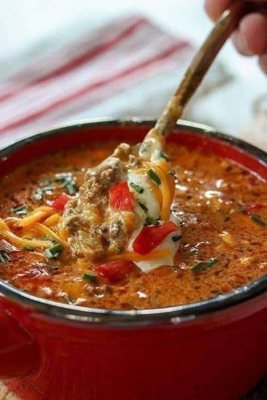 🌮 Homemade Beef Taco Soup There are some dinners that just make the whole house feel cozy, and a big pot of Homemade Beef Taco Soup is one of them. I love making this when the weather starts to cool down or when I need something comforting without spending hours in the kitchen. One weekend, I had ground beef in the fridge and a few cans of pantry staples sitting around, so I decided to turn them into a big pot of taco soup. It was one of those accidental dinners that turned into a family favorite. The beef is browned with onion and garlic, then simmered with tomatoes, beans, corn, green chiles, and warm taco spices. By the time everything comes together, the kitchen smells absolutely amazing. And then comes the fun part—the toppings. A little shredded cheese, a spoonful of sour cream, avocado, fresh cilantro, jalapeños, and crunchy tortilla chips turn a simple bowl of soup into something everyone can customize. That's probably why I love taco soup so much. It tastes like taco night, but you only need one pot. ❤️ Why You'll Love This Beef Taco Soup One-pot comfort food Easy enough for busy weeknights Packed with ground beef, beans, tomatoes, and corn Full of classic taco flavor Easy to make mild or spicy Perfect for feeding a family Excellent for leftovers Freezer-friendly Toppings can be customized for everyone Similar beef taco soup recipes rely on browned beef and onions, tomatoes, beans, corn, and taco seasoning, with many versions simmering for about 30 minutes to let the flavors come together. 🛒 Ingredients You'll Need For the Soup 1 pound ground beef 1 medium yellow onion, diced 3 garlic cloves, minced 1 red bell pepper, diced 1 can (15 ounces) black beans, rinsed and drained 1 can (15 ounces) kidney beans, rinsed and drained 1 can (15 ounces) corn, drained 1 can (28 ounces) diced tomatoes, with their juices 1 can (4 ounces) diced green chiles 2 cups beef broth 1 packet taco seasoning 1 teaspoon ground cumin 1/2 teaspoon smoked paprika 1/2 teaspoon chili powder 1/2 teaspoon salt, or to taste 1/4 teaspoon black pepper 1 tablespoon olive oil, if needed For Serving Shredded cheddar or Mexican-blend cheese Sour cream Diced avocado Fresh cilantro Sliced jalapeños Chopped green onions Lime wedges Tortilla chips or strips The combination of beans, corn, tomatoes, taco seasoning, and ground beef is a common foundation for taco soup, while toppings such as cheese, sour cream, jalapeños, avocado, and tortilla chips add contrasting textures. 🍲 How to Make Homemade Beef Taco Soup 1. Brown the Beef Heat a large Dutch oven or soup pot over medium-high heat. Add the ground beef and cook for about 5–7 minutes, breaking it apart with a wooden spoon as it cooks. Let the beef sit against the hot pan for a minute here and there rather than constantly stirring. Those little browned bits add so much flavor. If there's a lot of excess grease, drain it before continuing. 2. Add the Onion and Bell Pepper Add the diced onion and red bell pepper. Cook for about 4–5 minutes, stirring occasionally, until the onion begins to soften and the pepper is slightly tender. Add the minced garlic and cook for another 30–60 seconds. The smell at this point is incredible. 3. Add the Taco Seasonings Sprinkle in: Taco seasoning Cumin Smoked paprika Chili powder Black pepper Stir everything into the beef and vegetables. Cook for about 30 seconds so the spices become fragrant. 4. Add the Tomatoes and Green Chiles Pour in the diced tomatoes with their juices. Add the green chiles and stir well. The tomatoes provide the rich base for the soup, while the green chiles add a gentle peppery flavor. 5. Add the Beans and Corn Add the black beans, kidney beans, and drained corn. Give everything a good stir. I love using two different types of beans because they give the soup more texture and make every spoonful hearty. 6. Pour in the Broth Add the beef broth. Stir everything together and bring the soup to a gentle boil. Once bubbling, reduce the heat to low. 7. Simmer Cover the pot partially and let the soup simmer for 25–30 minutes. Stir occasionally. You can simmer it longer if you have the time. A little extra time allows the flavors to become deeper and richer. Taste near the end and adjust the salt, pepper, or chili powder as needed. 🌶️ How Spicy Is This Soup? As written, this is flavorful but not overwhelmingly spicy. If your family likes more heat, there are plenty of easy ways to turn it up. Try adding: Fresh jalapeño Extra green chiles Crushed red pepper flakes Cayenne pepper Chipotle powder Your favorite hot sauce If you're cooking for children or anyone who doesn't enjoy spicy food, keep the soup mild and put the hot toppings on the table instead. That way everyone wins. 🧀 The Best Taco Soup Toppings This is where taco soup gets really fun. Set out a few bowls of toppings and let everyone build their own. My favorites: Shredded cheese: Cheddar, Monterey Jack, Colby Jack, or Mexican blend. Sour cream: Adds a cool, creamy contrast to the spicy broth. Avocado: Gives the soup a buttery texture. Cilantro: Adds freshness. Jalapeños: For anyone who likes heat. Green onions: A mild onion flavor and beautiful color. Lime: A squeeze of fresh lime wakes up the entire bowl. Tortilla chips: Add them right before eating so they stay crunchy. You can even add a little pico de gallo on top. 🍋 Don't Forget the Lime This might seem like a tiny detail, but a squeeze of fresh lime makes a noticeable difference. The soup is rich and savory, while the lime adds acidity and brightness. I usually put lime wedges on the table and let everyone squeeze their own over the bowl. It's such a simple finishing touch. 🥑 Easy Variations Creamy Beef Taco Soup For a creamy version, stir in 4 ounces of softened cream cheese during the final 5–10 minutes of cooking. Stir until completely melted and smooth. You can also add a splash of heavy cream for an even richer soup. Cheesy Taco Soup Add 1 cup shredded cheddar cheese directly to the pot near the end. Stir until melted. Then add even more cheese to individual bowls. Because there's really no such thing as too much cheese here. Low-Carb Taco Soup For a lower-carb version, leave out the corn and beans. Add extra bell pepper, zucchini, mushrooms, or cauliflower instead. Serve with avocado, cheese, sour cream, and cilantro rather than tortilla chips. Chicken Taco Soup Swap the ground beef for shredded cooked chicken. Rotisserie chicken makes this especially quick. Turkey Taco Soup Ground turkey works beautifully in place of beef if you want a lighter-tasting version. Extra Smoky Taco Soup Add 1/2 teaspoon chipotle powder or a spoonful of adobo sauce. The smoky flavor is fantastic with the beef and tomatoes. 🍞 What to Serve With Beef Taco Soup This soup is filling enough to be a complete meal, but a few sides make it even better. Try serving it with: Cornbread Warm flour tortillas Tortilla chips Avocado salad Simple green salad Mexican rice Cauliflower rice Roasted vegetables Quesadillas If I'm making this for a casual weekend dinner, I usually put tortilla chips and all the toppings on the table and let everyone help themselves. It's easy, relaxed, and there's hardly any fuss. 🥄 How to Make the Soup Thicker If you prefer a thicker, almost chili-like consistency, there are a few easy tricks. Simmer uncovered Leave the lid off for the final 10–15 minutes so some of the liquid evaporates. Mash some beans Scoop out about 1/2 cup of beans, mash them with a fork, and stir them back into the soup. This thickens the broth naturally. Add more vegetables Corn, beans, peppers, and tomatoes naturally give the soup plenty of texture. I prefer this method rather than adding flour or cornstarch. ⏰ Can You Make Taco Soup Ahead? Absolutely. In fact, taco soup is one of those meals that often tastes even better the next day. The spices have more time to mingle, and the beef and vegetables absorb even more of the flavorful broth. Prepare the soup completely, allow it to cool, then refrigerate it in a covered container. When you're ready to eat, gently reheat it on the stovetop. 🧊 Storage Allow leftovers to cool before transferring them to airtight containers. Store in the refrigerator for up to 4 days. Keep toppings such as tortilla chips, avocado, sour cream, and fresh cilantro separate. Reheat individual portions in the microwave or warm larger quantities gently on the stovetop. If the soup thickens in the refrigerator, simply add a splash of beef broth or water while reheating. ❄️ Can You Freeze Beef Taco Soup? Yes! This is a fantastic freezer meal. Let the soup cool completely, then transfer it to freezer-safe containers or bags. Leave a little room for expansion. Freeze for up to 3 months for the best quality. Thaw overnight in the refrigerator and reheat gently on the stovetop. Add fresh toppings after reheating. Taco soup recipes are commonly recommended as freezer-friendly meals, making a large batch especially useful for future dinners. 🥣 Make It a Meal-Prep Recipe If you're trying to make weeknight dinners easier, this soup is perfect for meal prep. Cook a large batch on Sunday and portion it into individual containers. Keep toppings separate. Then you have an easy lunch or dinner ready to heat throughout the week. I especially love packing cheese, lime, and a little cilantro separately so the soup tastes freshly assembled rather than like reheated leftovers. ❓ Frequently Asked Questions Can I use ground turkey instead of ground beef? Yes. Ground turkey is an easy substitute. You may want to add an extra teaspoon of olive oil if the turkey is very lean. Can I use fresh tomatoes? You can, although canned tomatoes are convenient and provide consistent flavor and liquid. If using fresh tomatoes, add extra broth as needed. Can I use different beans? Absolutely. Pinto beans, cannellini beans, or chili beans can all work. Do I have to use corn? No. Corn is traditional in many versions, but you can leave it out or replace it with another vegetable. Can I make this in a slow cooker? Yes. Brown the beef and onion first, then transfer everything to the slow cooker. Cook on LOW for 5–6 hours or HIGH for about 3–4 hours, until the flavors have developed and everything is hot. Slow-cooker versions of taco soup commonly use a similar low-and-slow approach. Can I make it without taco seasoning? Yes. Make your own with chili powder, cumin, paprika, garlic powder, onion powder, oregano, salt, and black pepper. How do I make taco soup less spicy? Use mild green chiles, mild taco seasoning, and skip the jalapeños and cayenne. Why does my taco soup taste better the next day? The extra resting time allows the spices and savory ingredients to mingle throughout the broth. That's one reason taco soup is such a good make-ahead meal. Can I make it vegetarian? Yes. Omit the beef and replace it with extra beans, lentils, mushrooms, or a plant-based ground meat alternative. Use vegetable broth instead of beef broth. 📝 Recipe at a Glance Prep Time: 10 minutes Cook Time: 35 minutes Total Time: About 45 minutes Servings: 6 Category: Soup / Dinner Cuisine: Tex-Mex inspired Method: Stovetop Freezer-Friendly: Yes 🌮 Homemade Beef Taco Soup Recipe Ingredients 1 lb ground beef 1 medium yellow onion, diced 3 garlic cloves, minced 1 red bell pepper, diced 1 (15 oz) can black beans, drained and rinsed 1 (15 oz) can kidney beans, drained and rinsed 1 (15 oz) can corn, drained 1 (28 oz) can diced tomatoes 1 (4 oz) can diced green chiles 2 cups beef broth 1 packet taco seasoning 1 tsp ground cumin 1/2 tsp smoked paprika 1/2 tsp chili powder 1/2 tsp salt, or to taste 1/4 tsp black pepper Toppings Shredded cheddar cheese Sour cream Avocado Fresh cilantro Jalapeños Green onions Lime wedges Tortilla chips Instructions Brown the ground beef in a large pot over medium-high heat for 5–7 minutes, breaking it apart as it cooks. Drain excess grease if necessary. Add onion and bell pepper and cook for 4–5 minutes. Add garlic and cook for 30–60 seconds. Stir in taco seasoning, cumin, smoked paprika, chili powder, salt, and pepper. Add diced tomatoes and green chiles. Stir in black beans, kidney beans, and corn. Pour in the beef broth. Bring to a gentle boil. Reduce heat and simmer partially covered for 25–30 minutes. Taste and adjust seasonings. Ladle into bowls and add your favorite toppings. Finish with fresh lime and serve hot. ❤️ Final Thoughts This Homemade Beef Taco Soup is exactly the kind of dinner I want on a busy night—a little messy, wonderfully cozy, full of flavor, and easy enough that I don't have to think too hard about it. The best part is watching everyone make their bowl differently. Someone wants extra cheese. Someone wants more jalapeños. Someone piles on avocado and sour cream. And someone inevitably grabs the tortilla chips and starts eating them straight from the bag. That's what makes recipes like this special. They're not fancy, and they don't need to be. It's just a big warm pot of taco-inspired goodness that brings everyone to the table—and sometimes that's the very best kind of dinner.